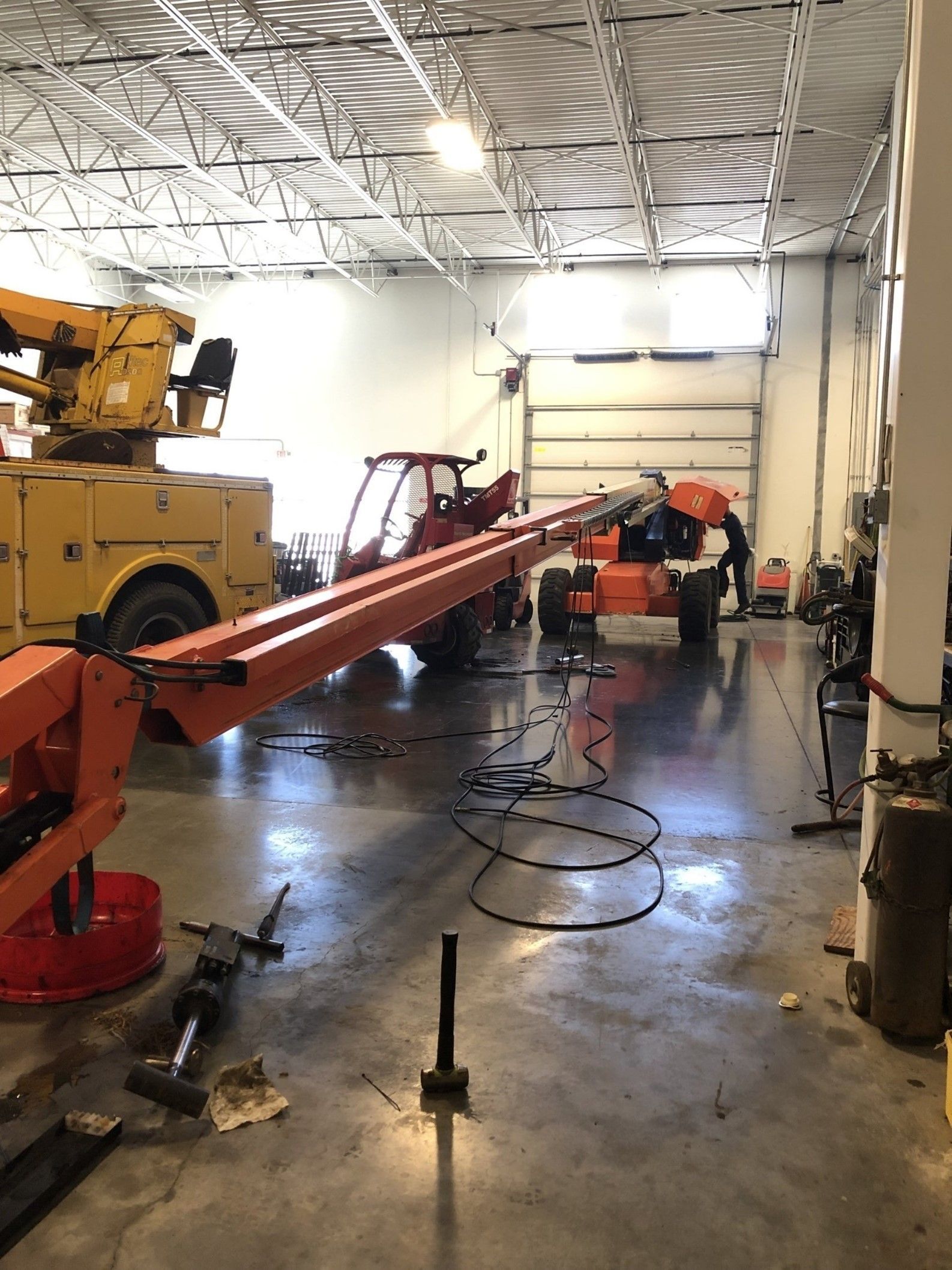Man Is Working On A Crane — Lincoln, NE — Central States Hydraulic Services
