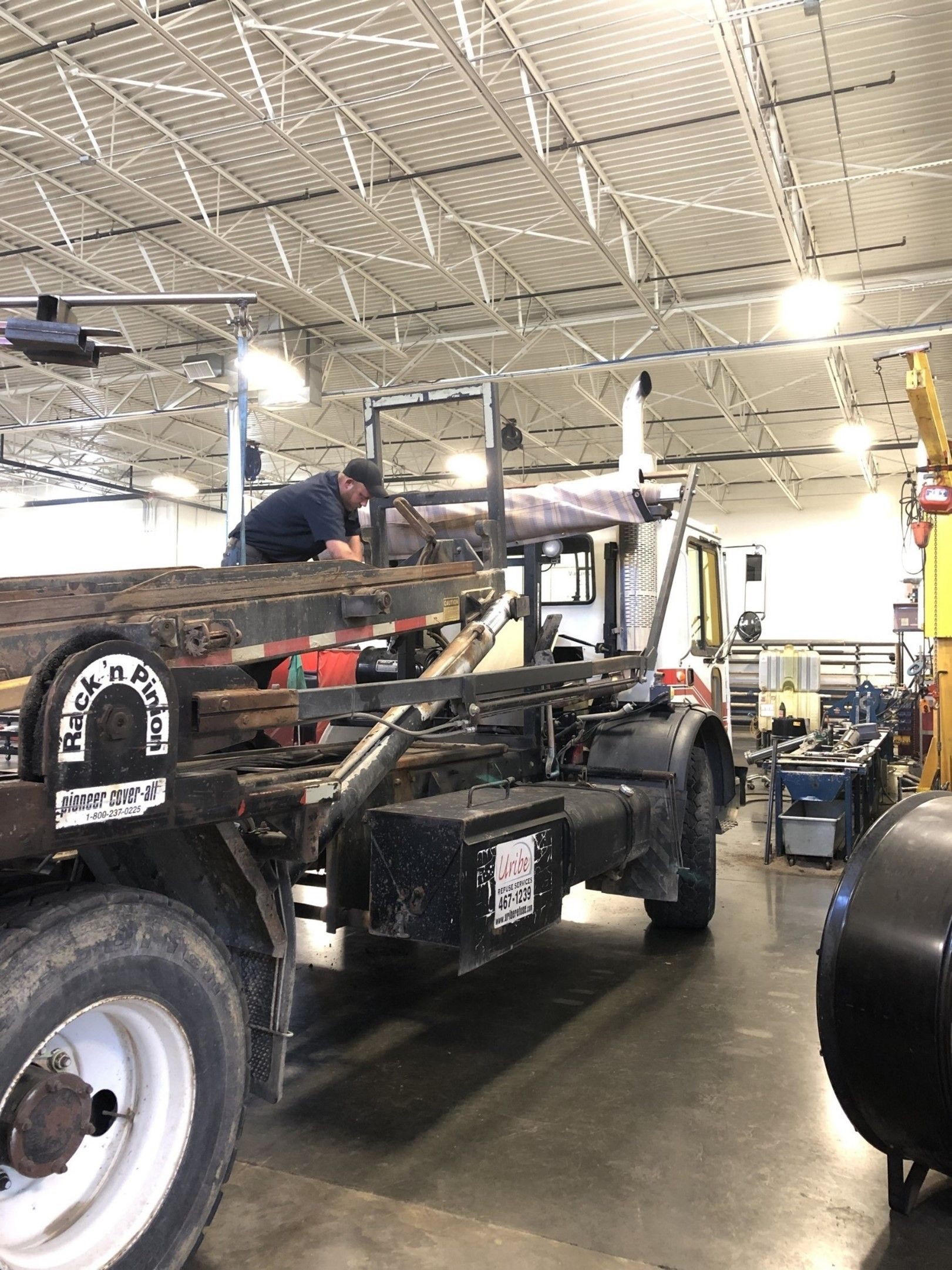 Man Is Working On A Dump Truck — Lincoln, NE — Central States Hydraulic Services