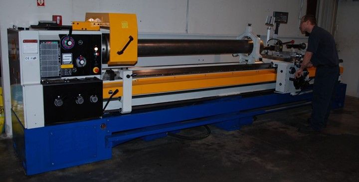 Man Is Working On A Lathe — Lincoln, NE — Central States Hydraulic Services