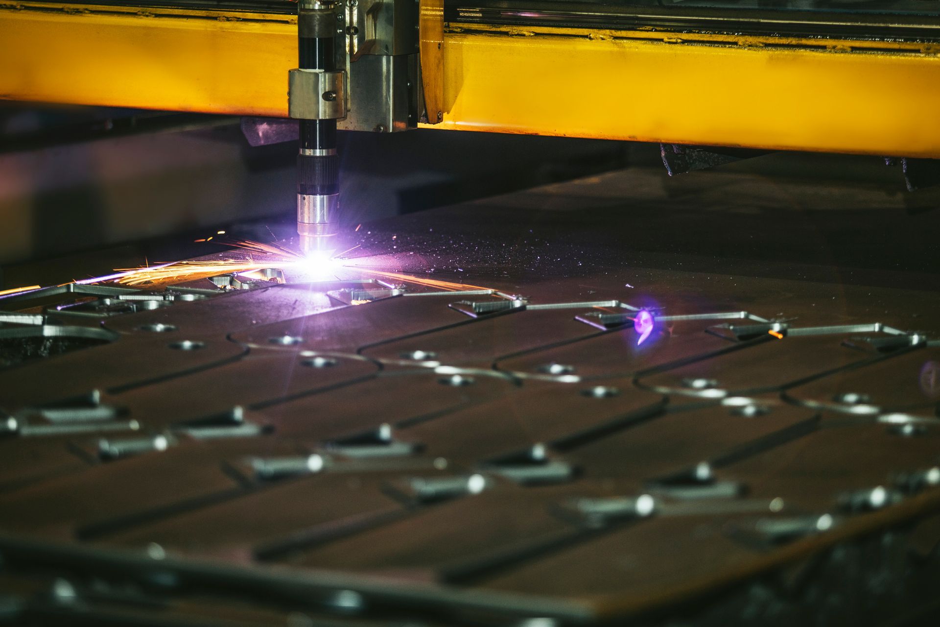 Laser equipment in metal plant, showcasing advanced CNC precision machining processes.