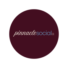 A circular, dark maroon logo with the white and light blue text 