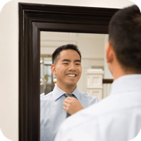 A Man Looking at Himself in the Mirror — Sunnyside, WA — Yakima Valley Chiropractic Center