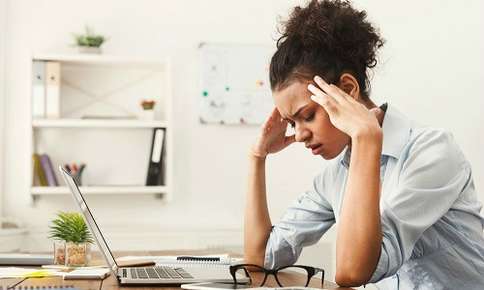 Woman Experiencing Headache at Work — Sunnyside, WA — Yakima Valley Chiropractic Center