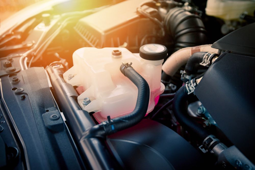 Car Engine Bay With Coolant Reservoir, Hoses — A1 Mobile Safety Certificates in Redlynch, QLD