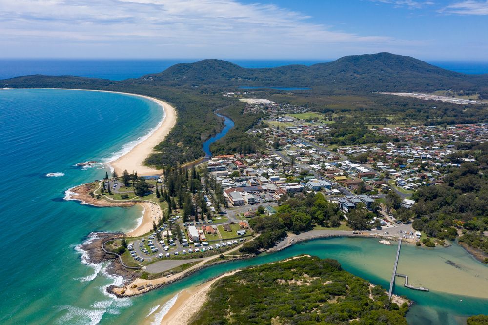 Aerial View of a Coastal Town With a Sandy Beach — A1 Mobile Safety Certificates in Northern Beaches, NSW