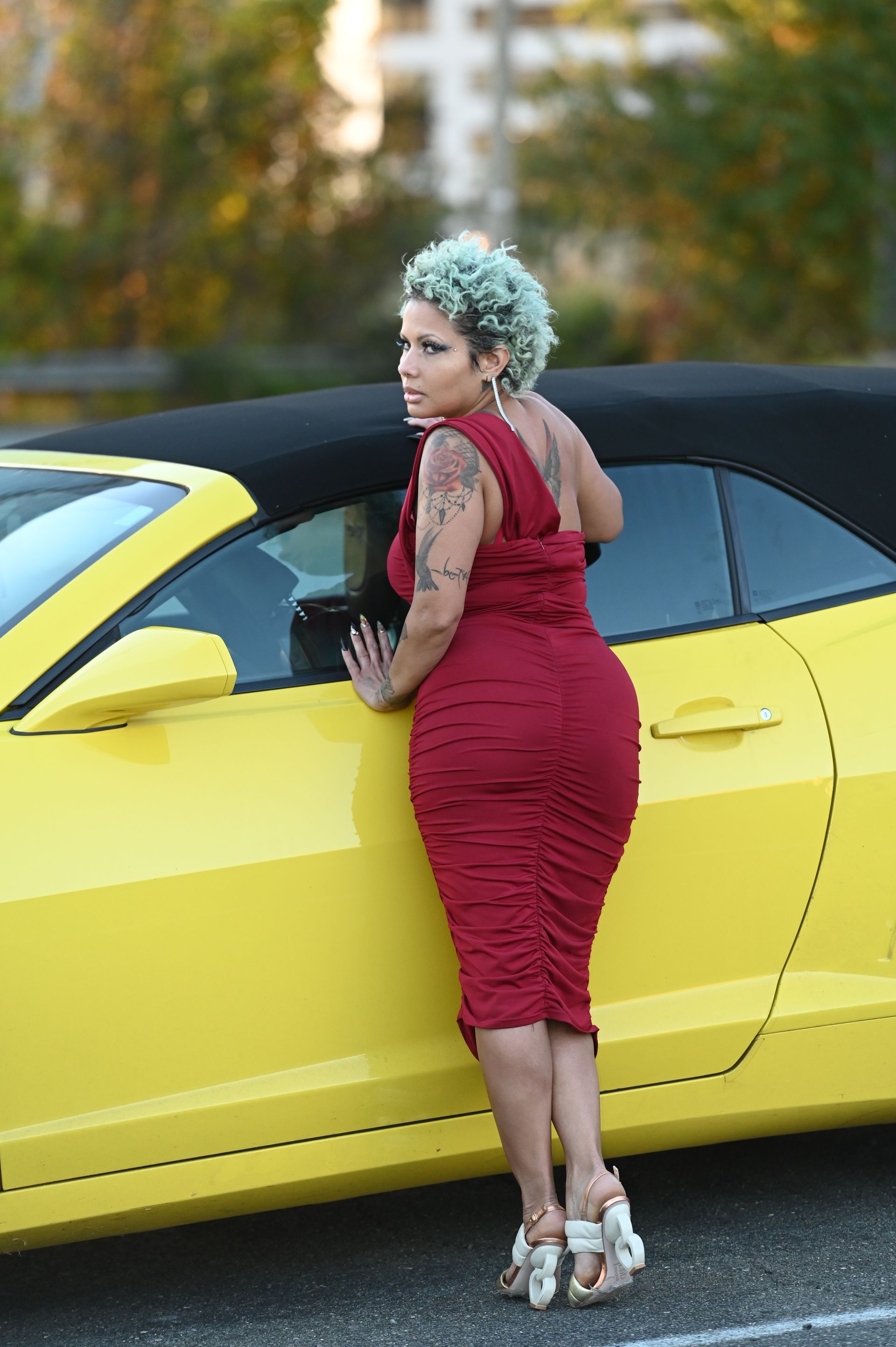 Woman Posing Showing Back Beside Camaro - McLean, VA | Haute Feng Shui