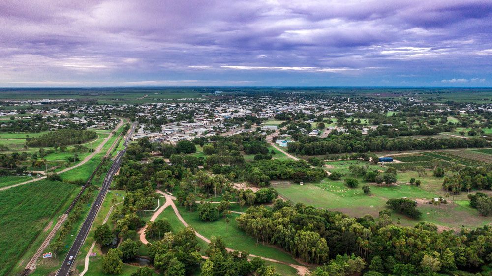 An Aerial View of A Small Town Surrounded by Trees and Fields — Ryde Energy in Flagstone, QLD