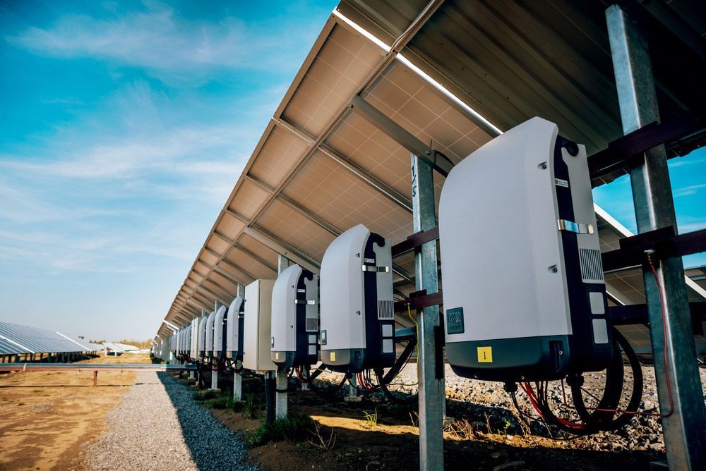 A Row of Solar Panels Inverter Are Lined up In a Field — Ryde Energy in Browns Plains, QLD