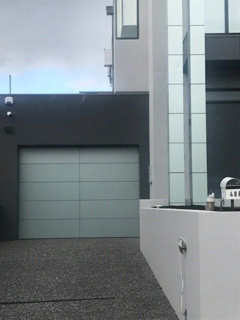 A modern house with a blue garage door