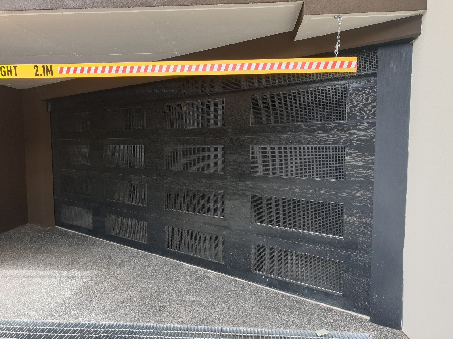 A garage door with a yellow tape that says gat on it