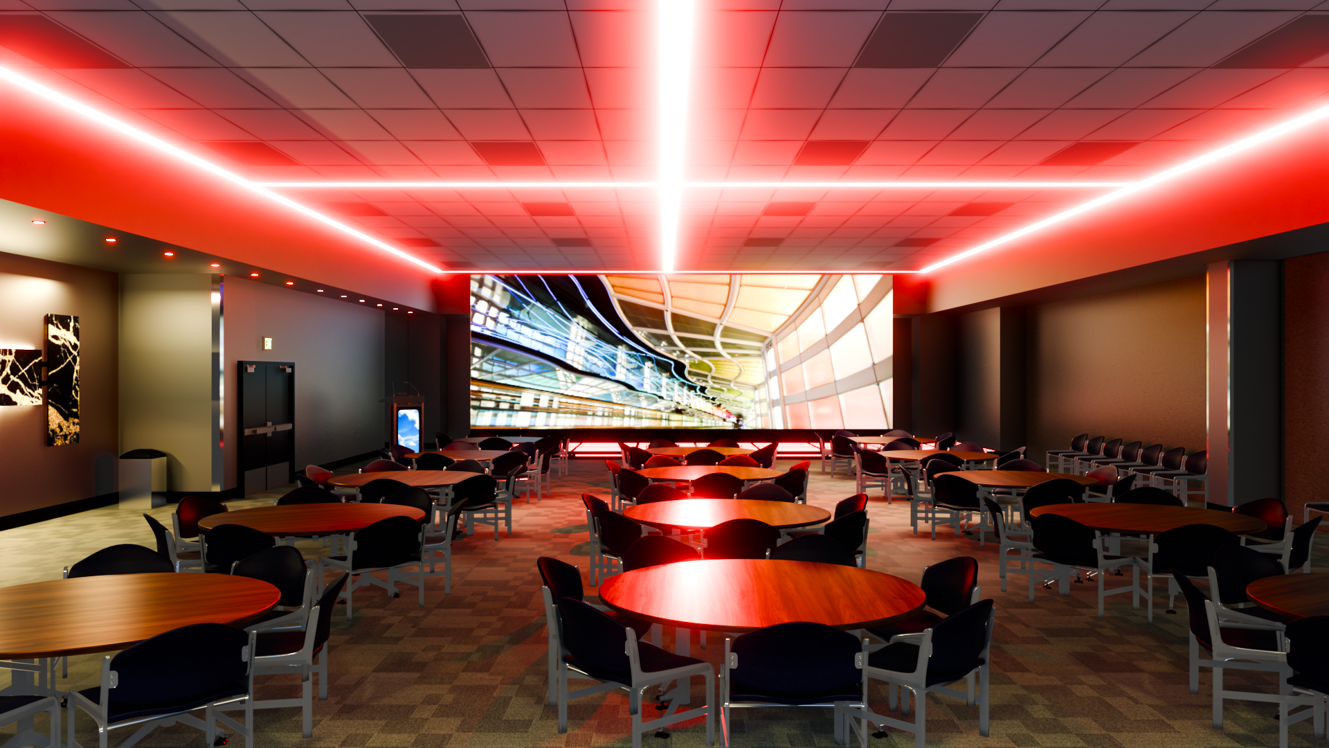 A large room with tables and chairs and a large screen on the wall.