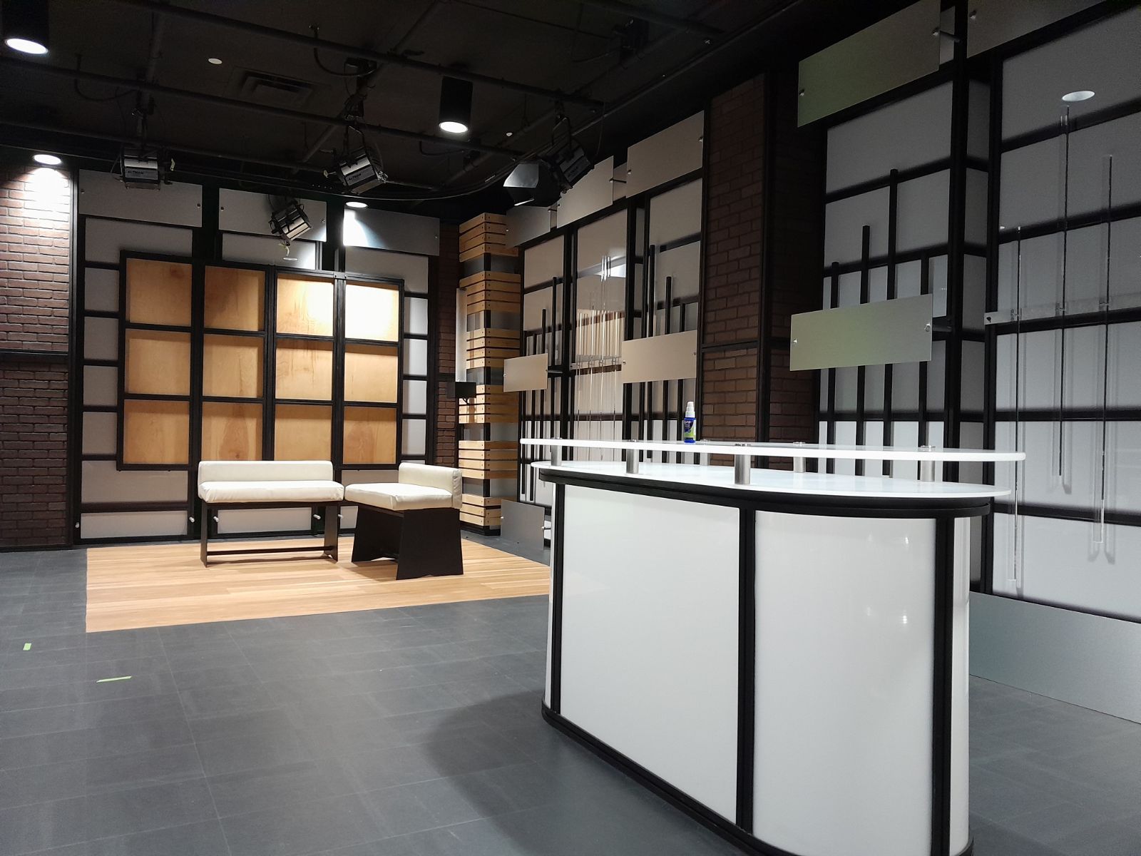 An empty room with a white counter in the middle