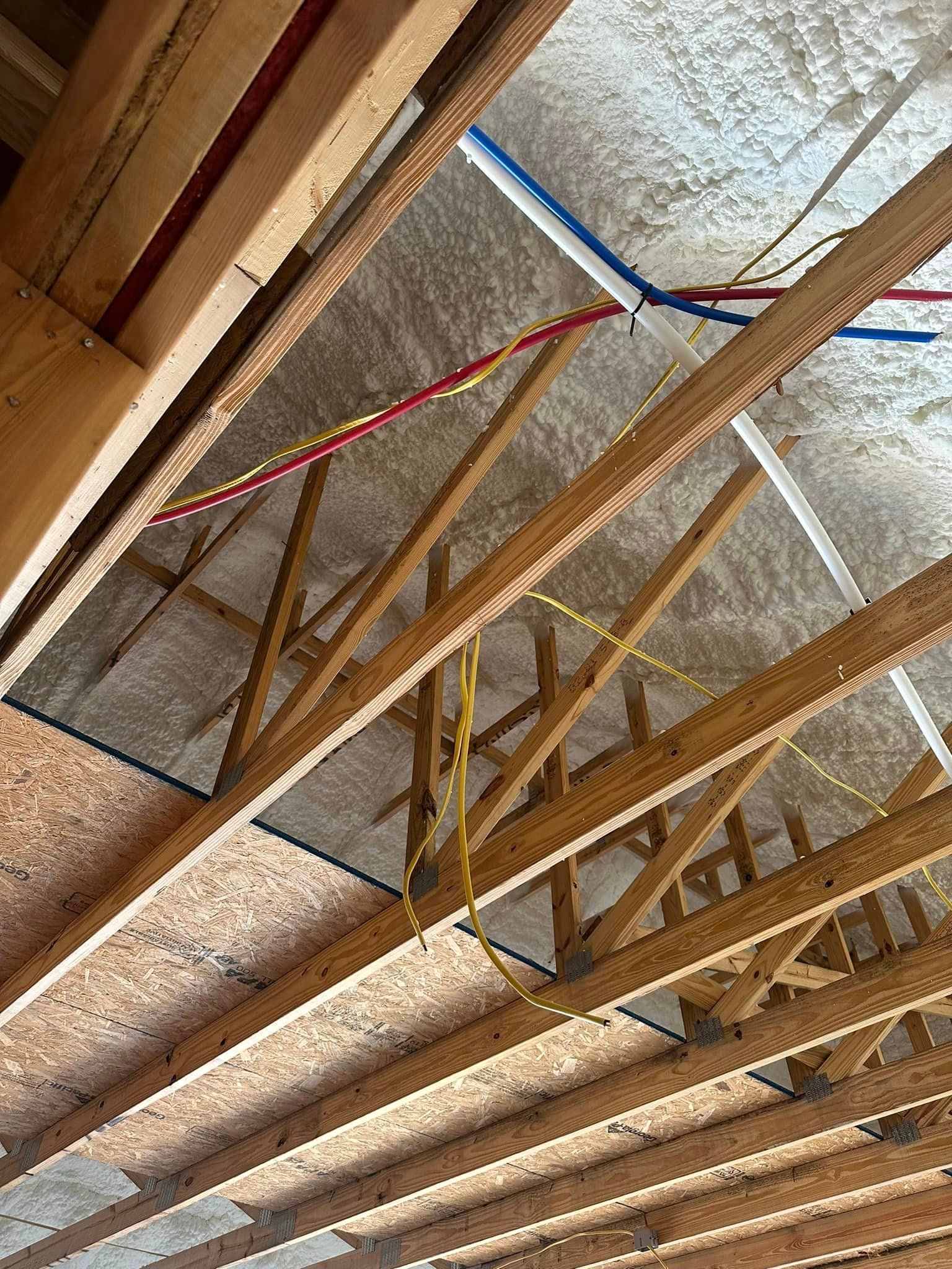 looking up at the ceiling of a house under construction .