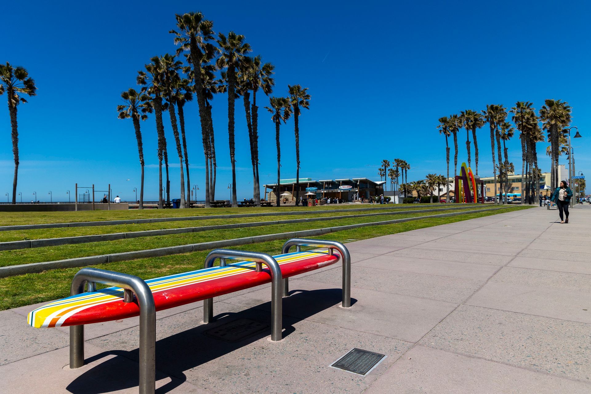 a bench with a surfboard painted on it