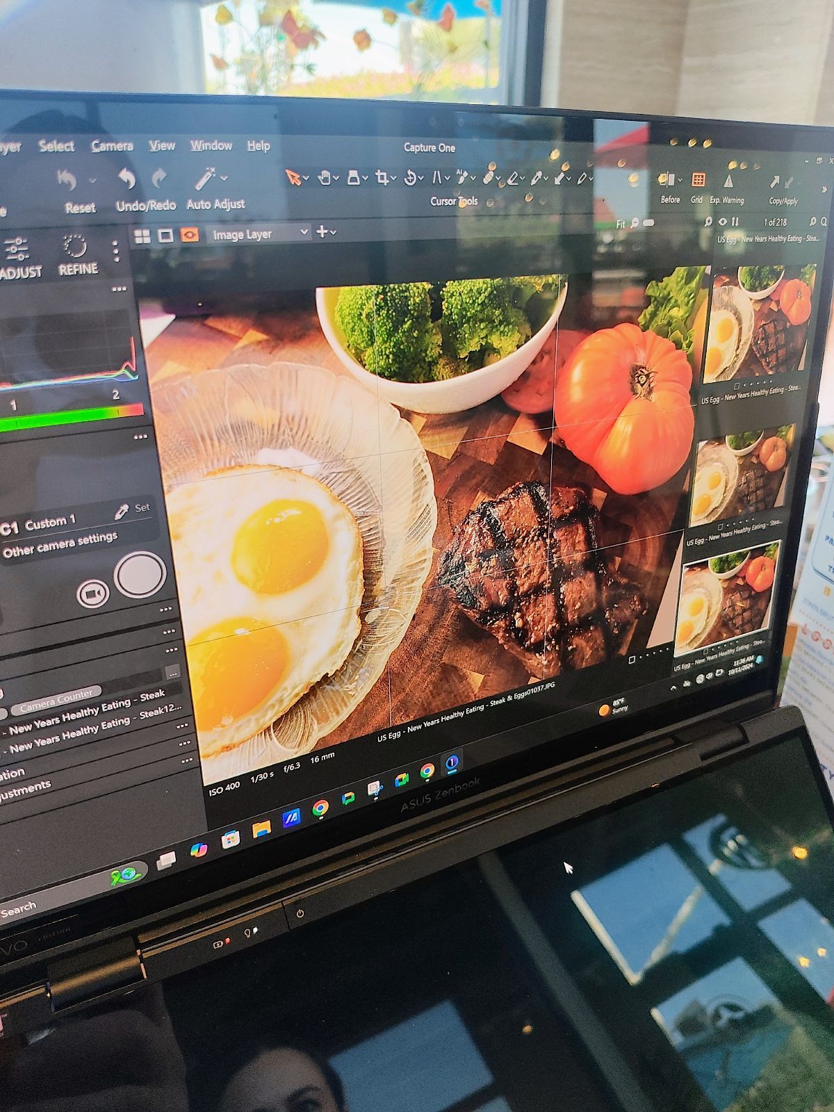 A laptop with a picture of food on the screen