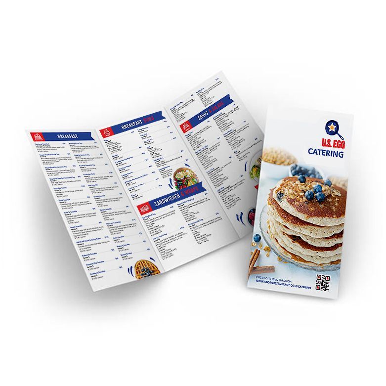 A folded menu with a picture of pancakes on it.