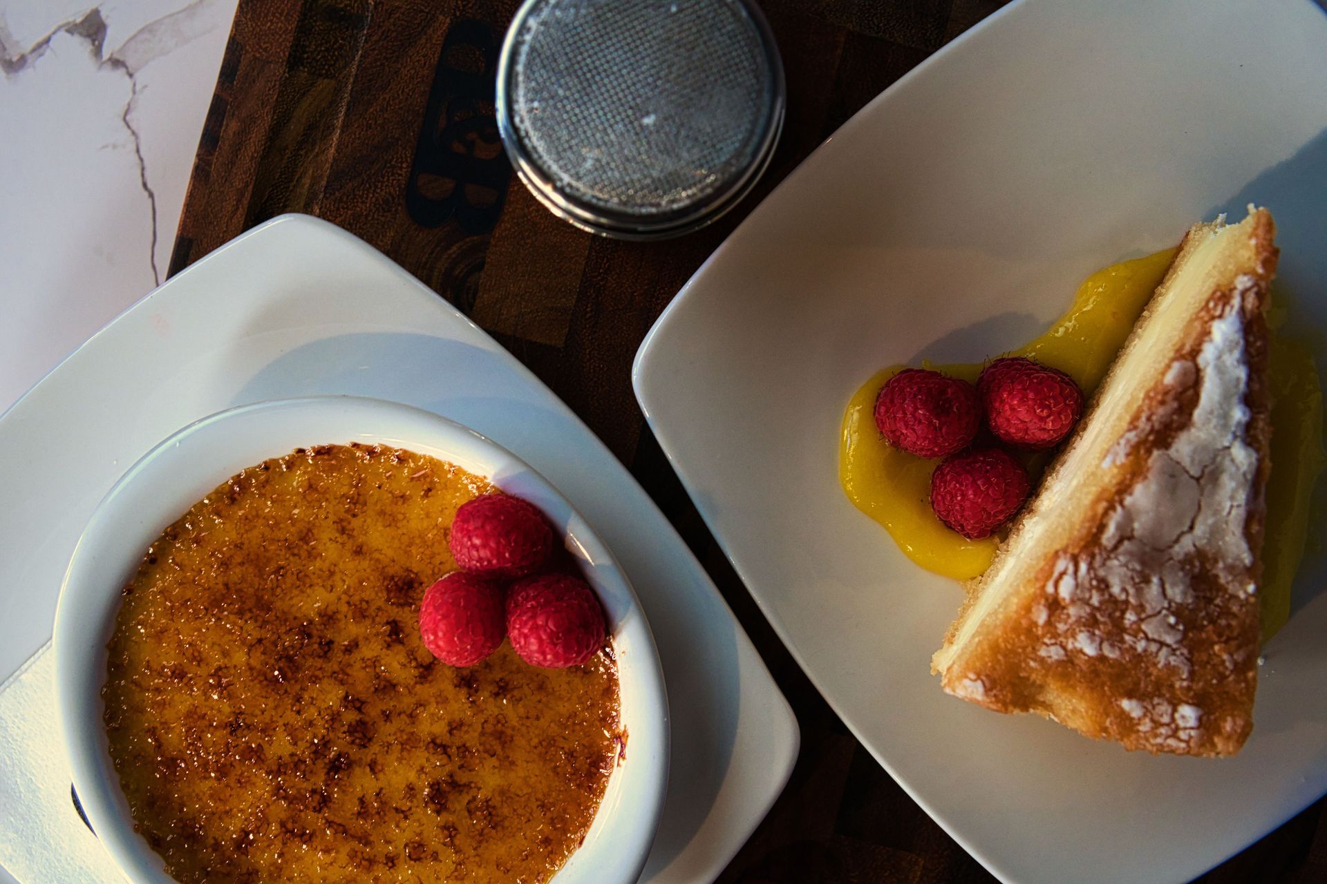 A bowl of dessert next to a plate of dessert