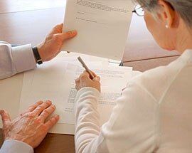 Client signing paper - Law services in Sterling Heights