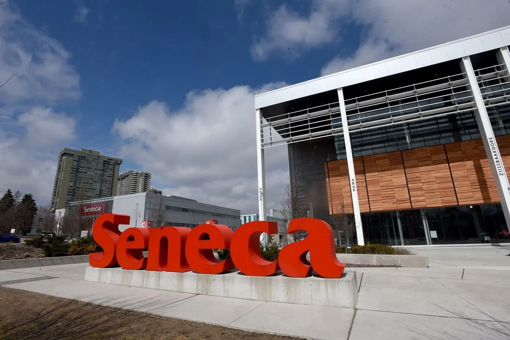 A large red seneca sign in front of a building