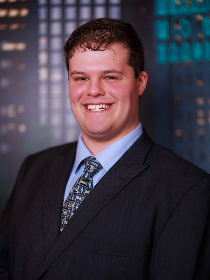 A man in a suit and tie is smiling for the camera. Toronto Headshot Photography