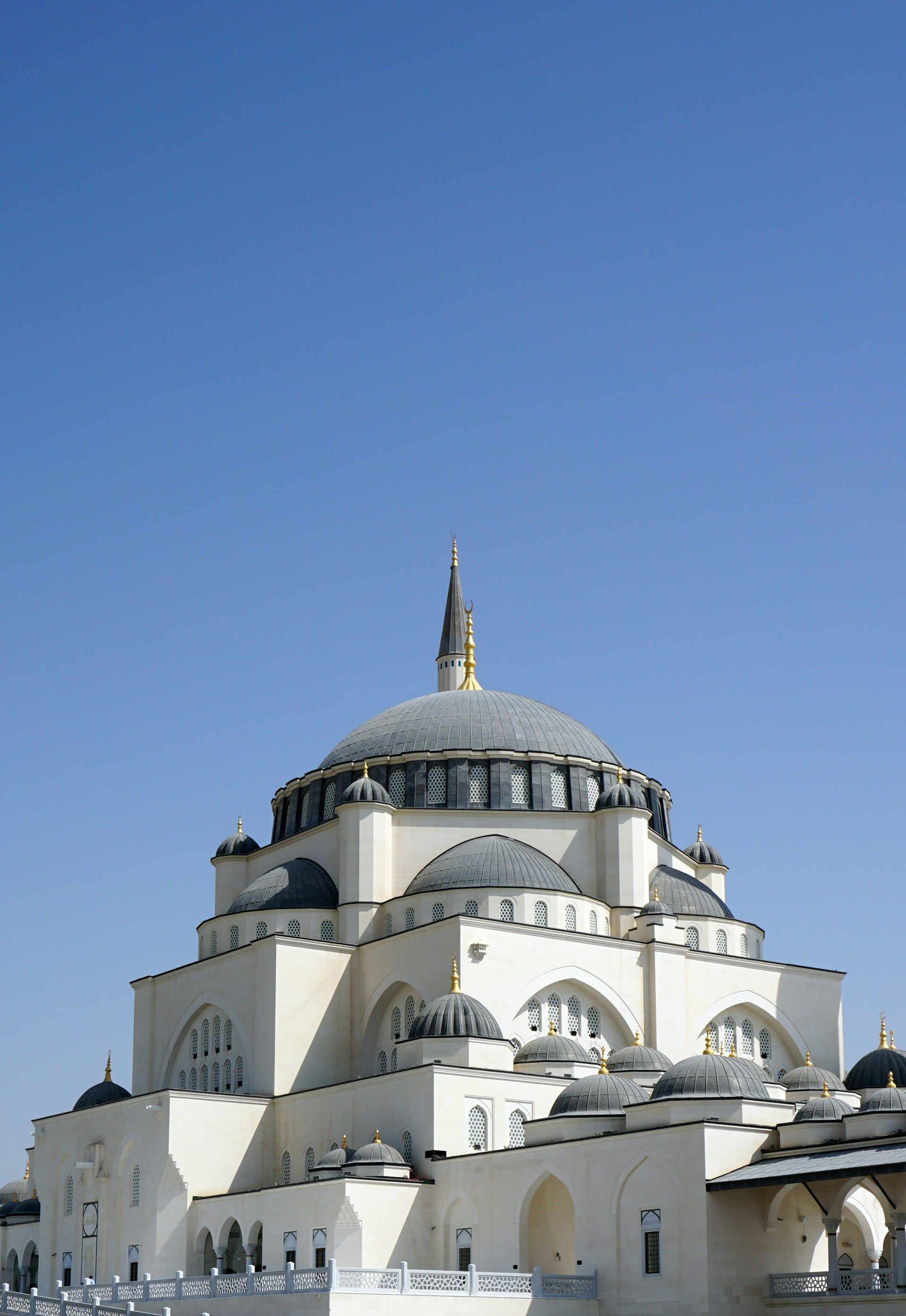 A large white building with a dome on top of it