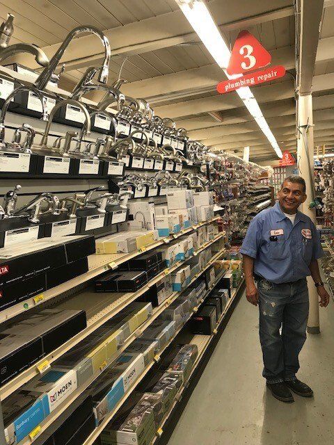 Faucets with man | San Mateo, CA | Bayside Building Materials, Inc.