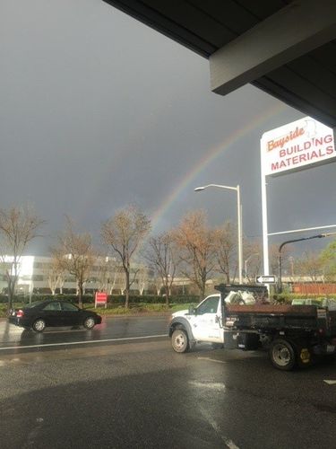 Cars with rainbow above | San Mateo, CA | Bayside Building Materials, Inc.