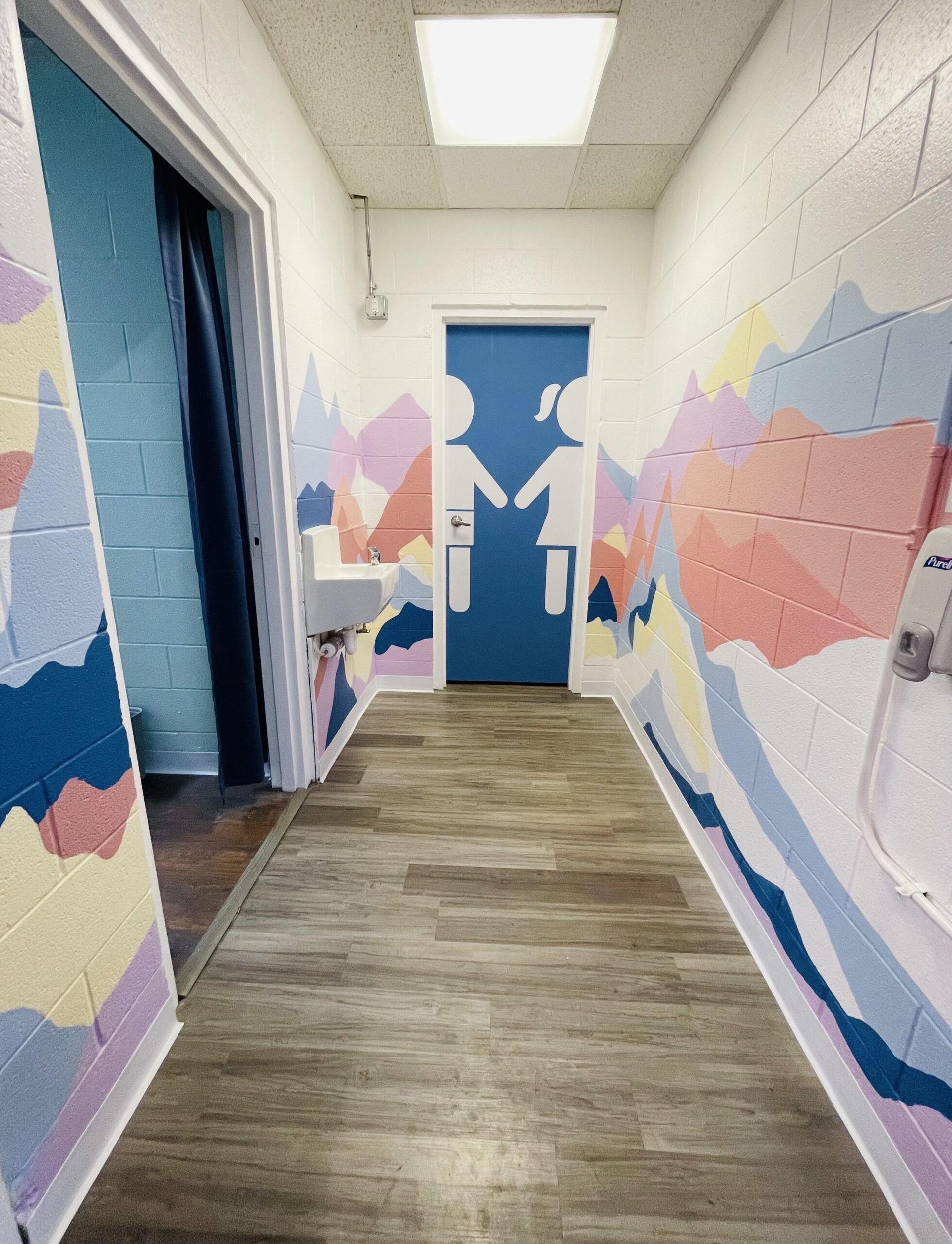 A picture of our back hall decorated with colorful mountains