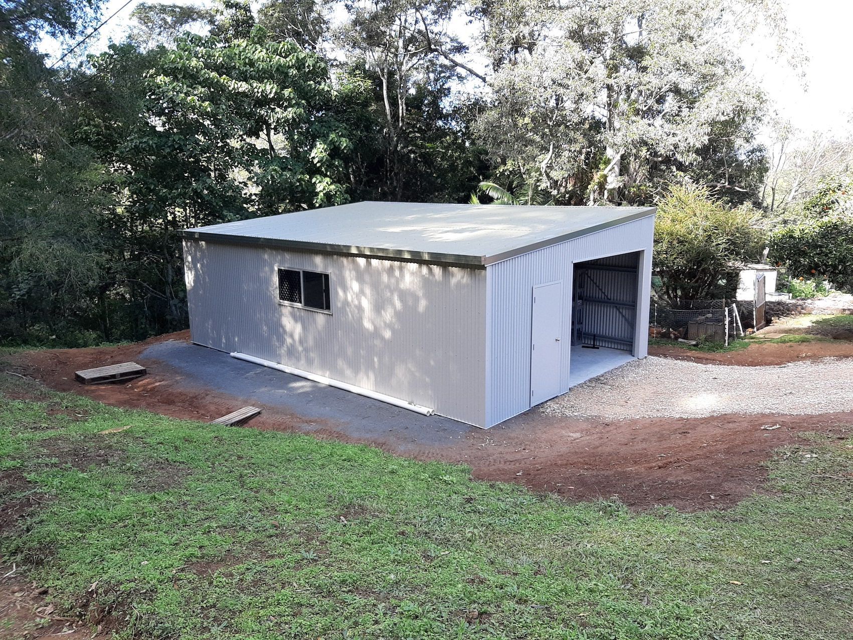 Garage Shed Set Into Hill — Shed Kits in Lismore, NSW