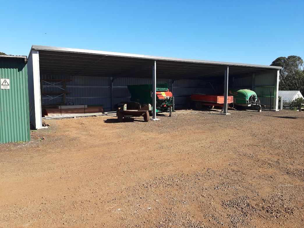 Spacious Open Shed with Parked Vehicles — Shed Kits in Lismore, NSW