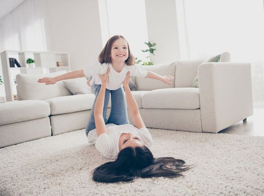 Mother And Daughter Playing On Carpet — Lancaster, OH — Ewing Steam Cleaning Inc.