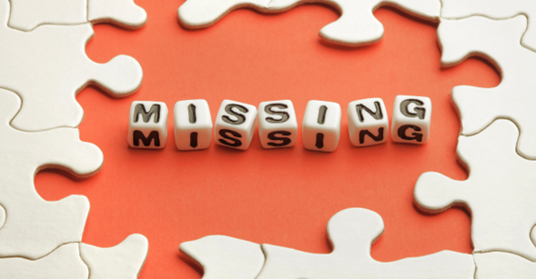 A jigsaw puzzle with missing middle pieces, and beaded letters spelling 'Missing' in their place 