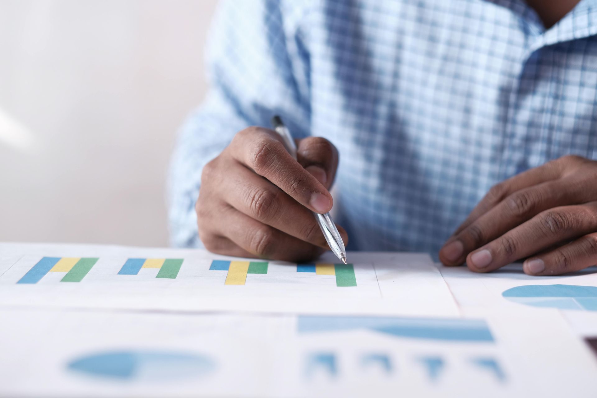 Business man reading statistics on a piece of paper