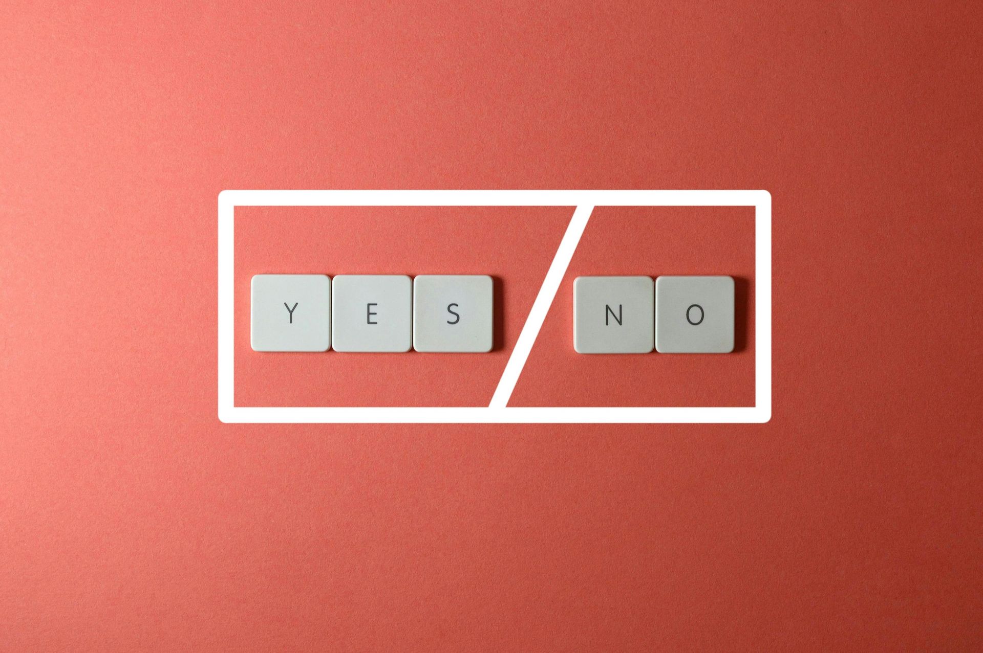 Letter tiles on a red background spelling 'Yes' / 'No'