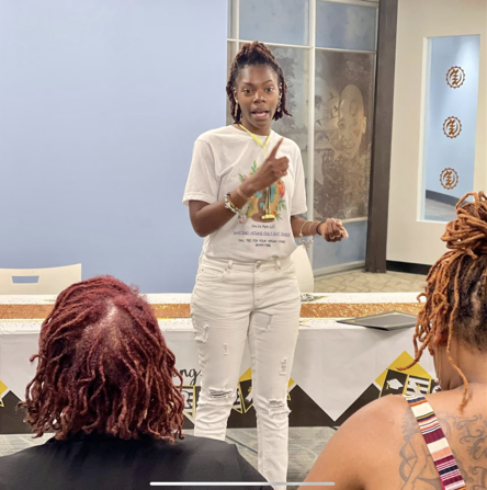 A person is cooking food in a frying pan on a stove.