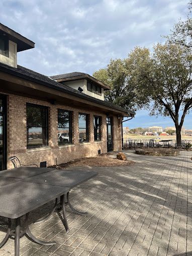 There is a table and chairs outside of a building.