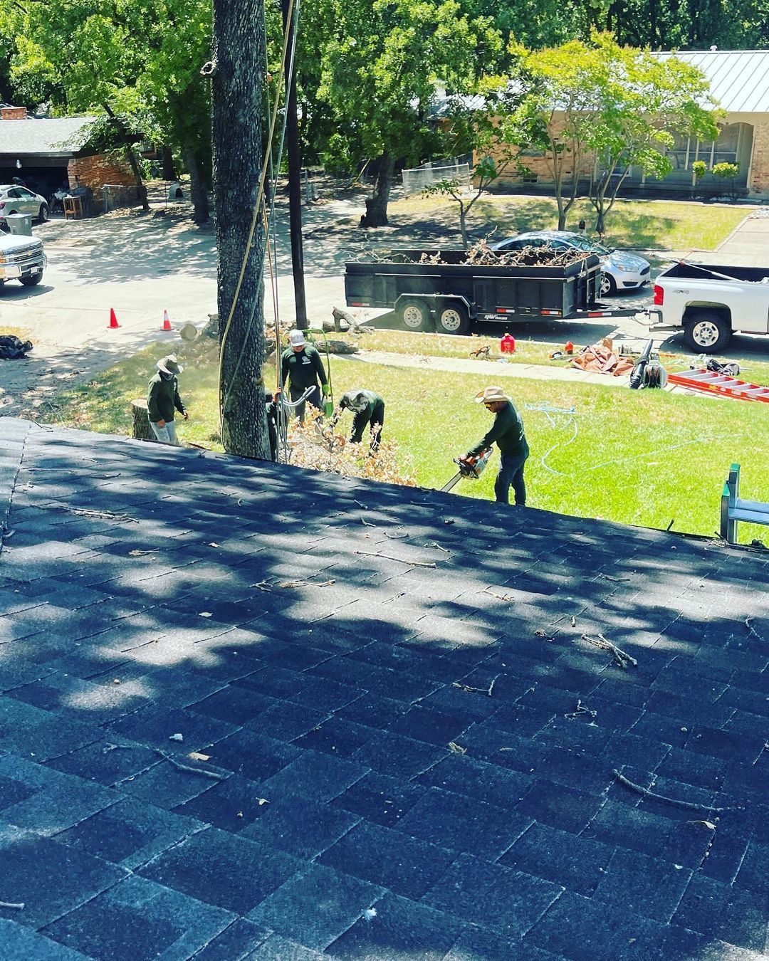 A group of people are working on a roof.