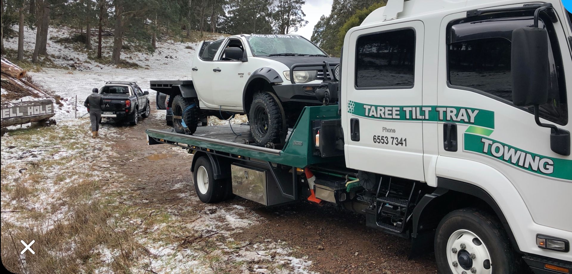 A Yellow Car is on the Back of a Tow Truck — Taree Tilt Tray Towing In Pampoolah, NSW