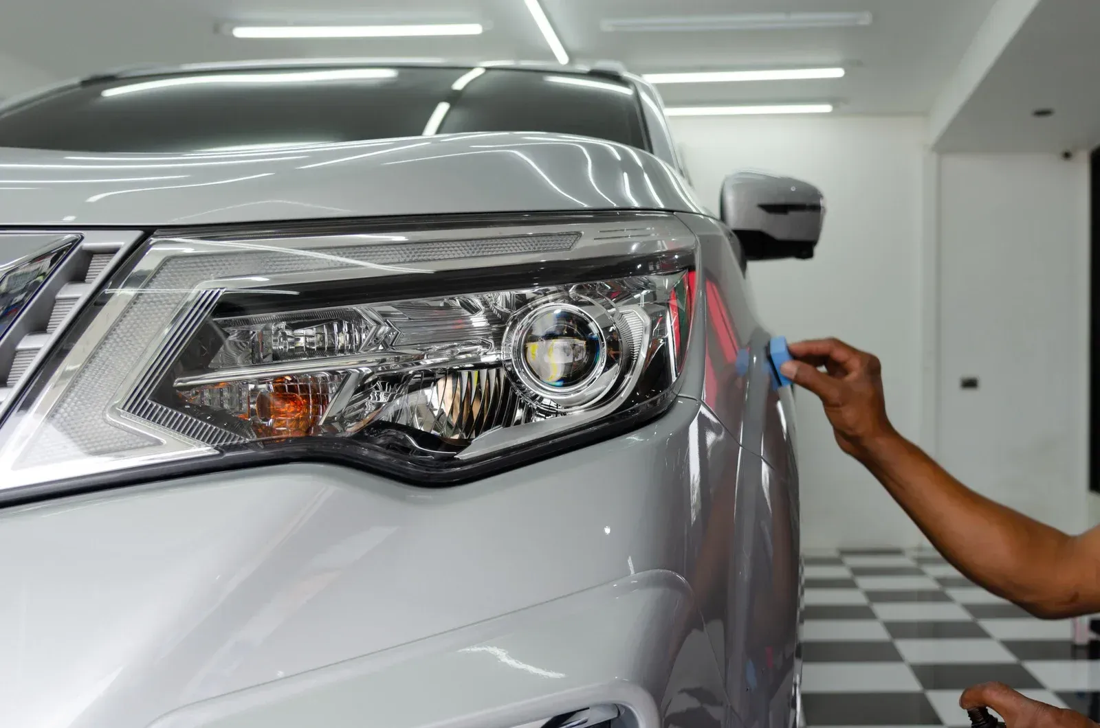 Bright green sports car parked outdoors on a sunny day.