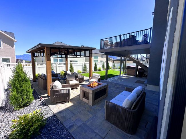 There is a fire pit in the middle of the patio.