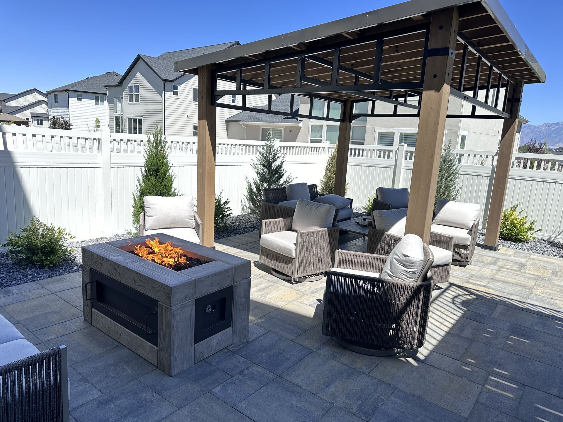There is a fire pit in the middle of the patio.