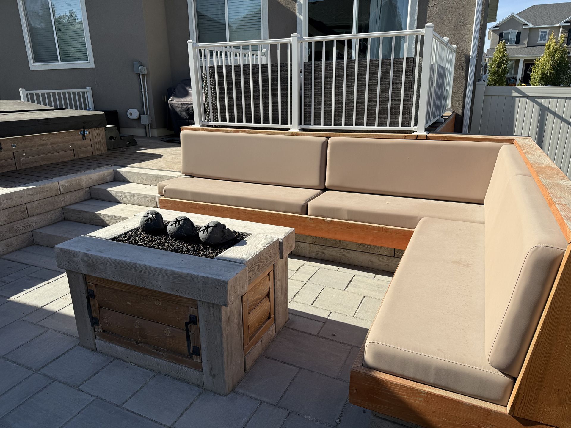 There is a fire pit in the middle of the patio.