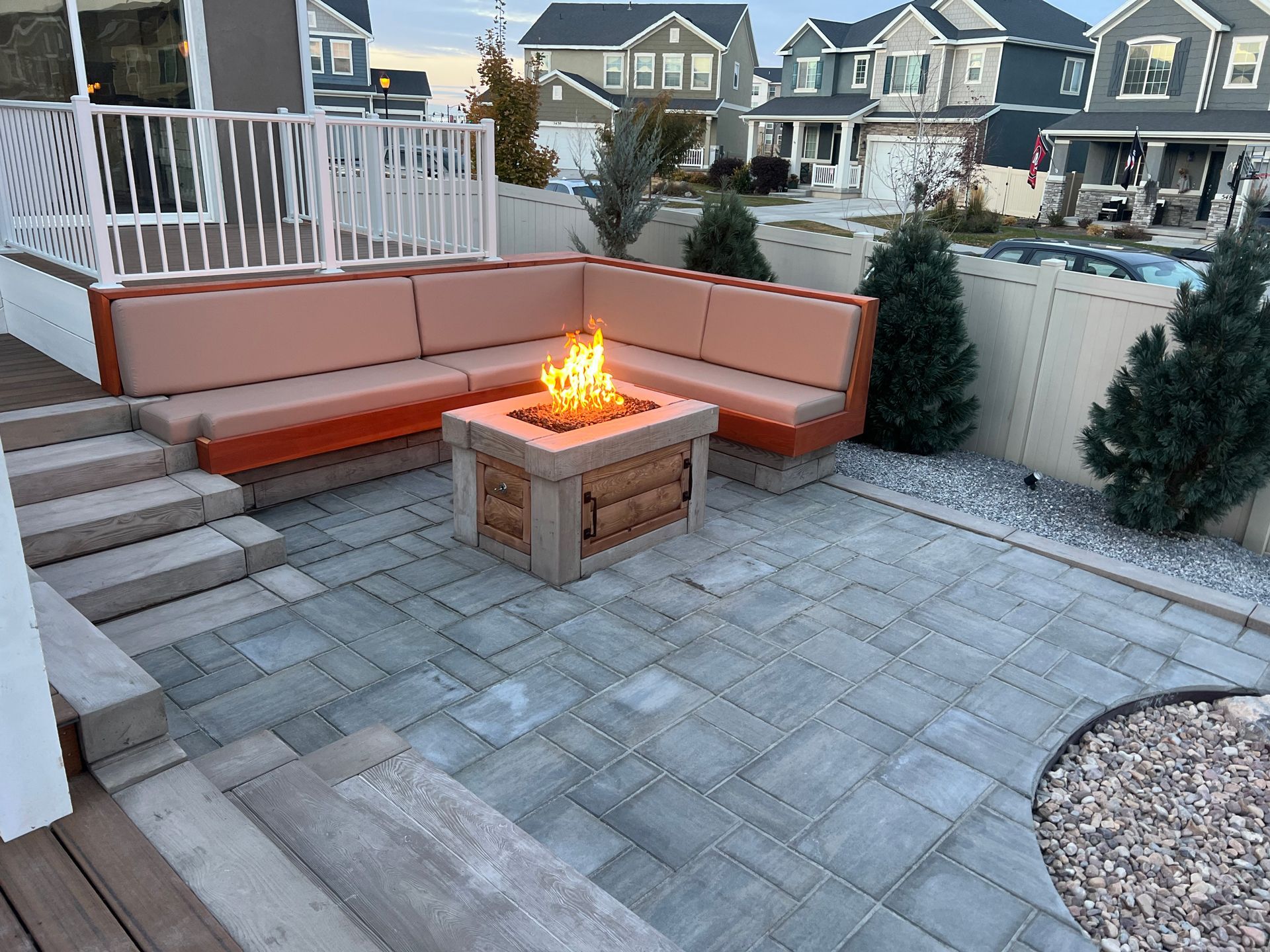 There is a fire pit in the middle of the patio.