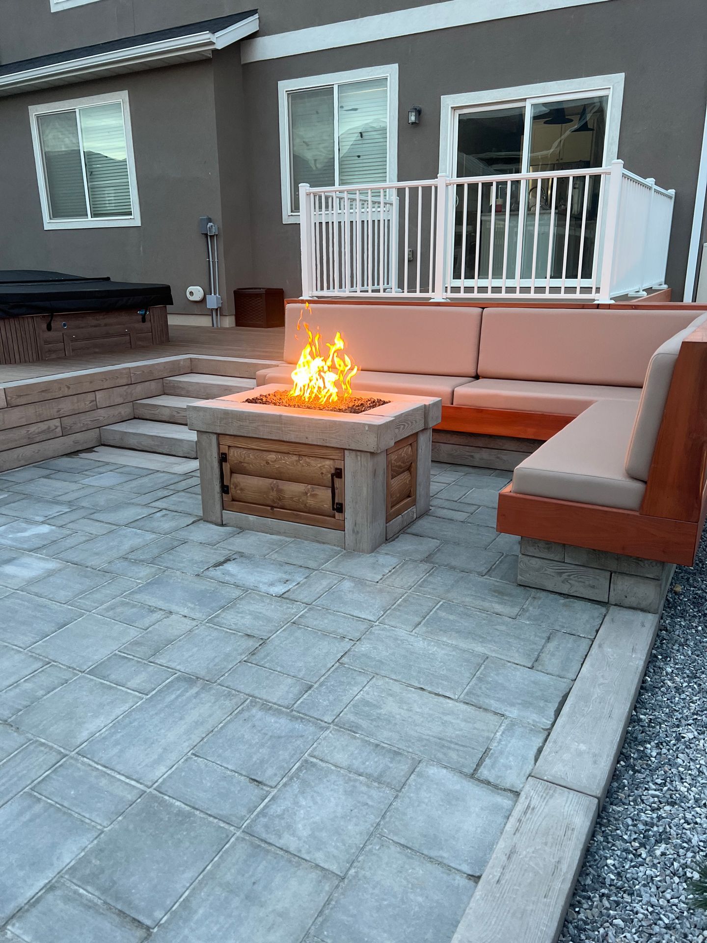 There is a fire pit in the middle of the patio.