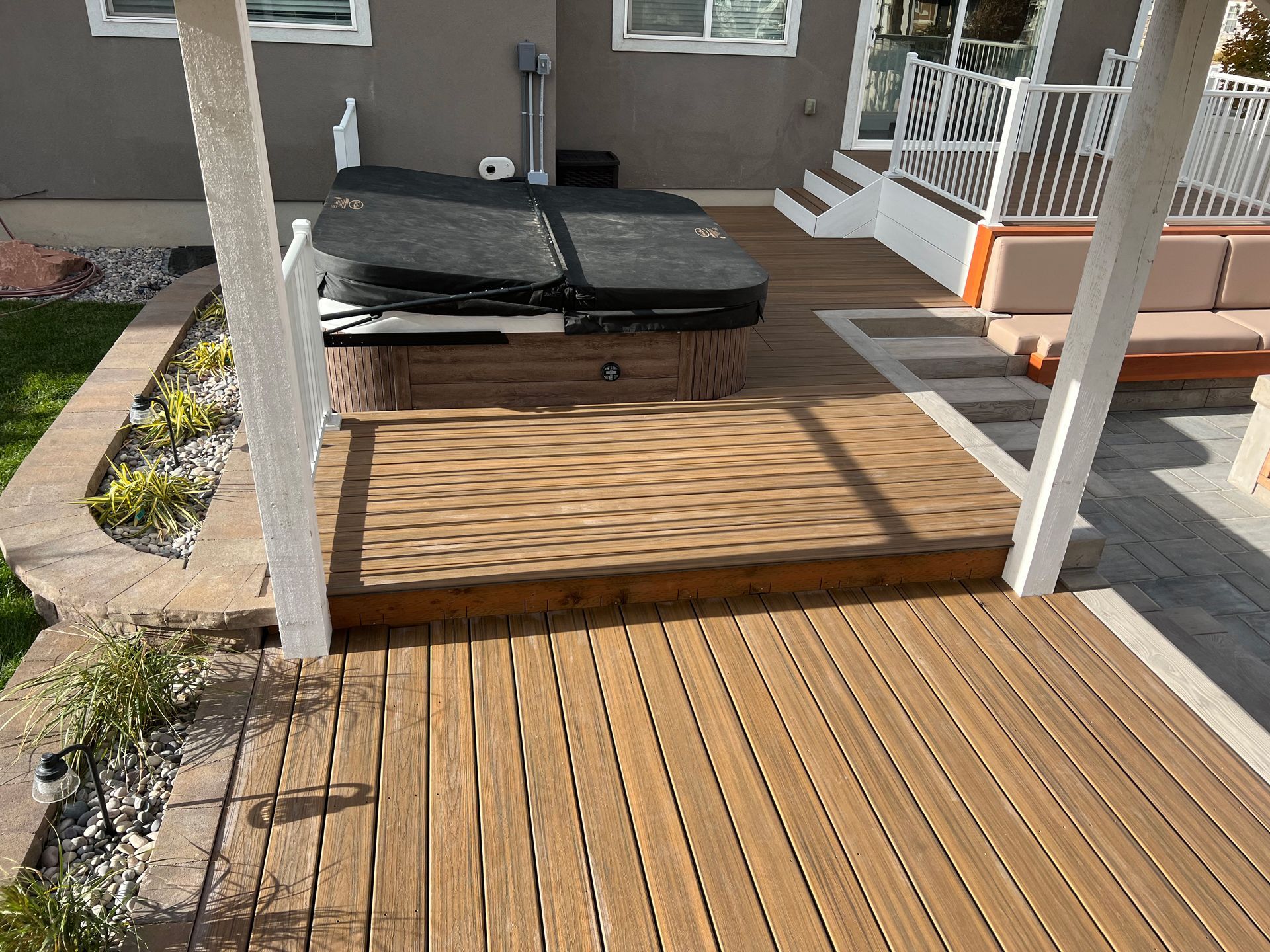 A wooden deck with a hot tub on it