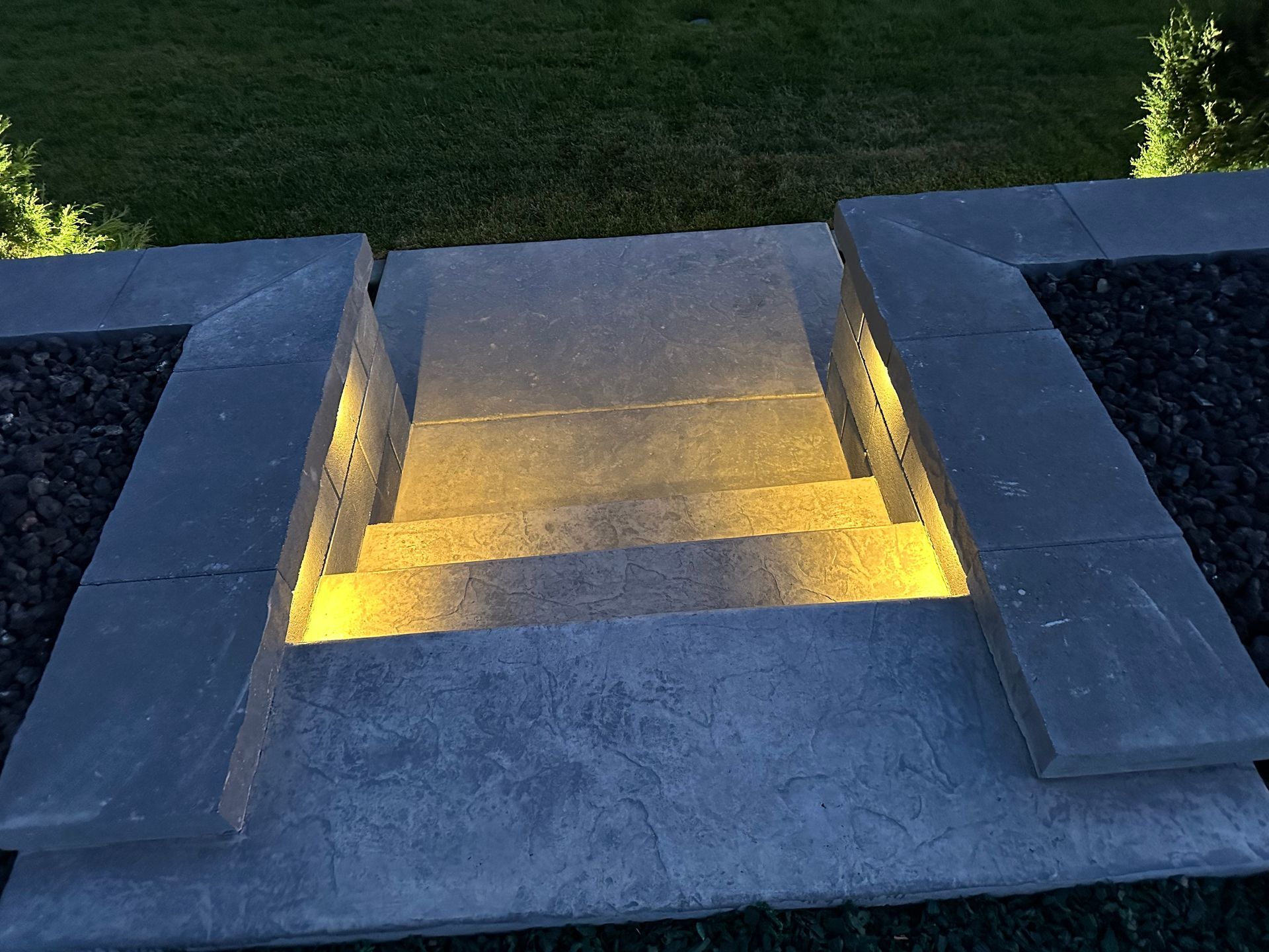 A set of stairs that are lit up at night