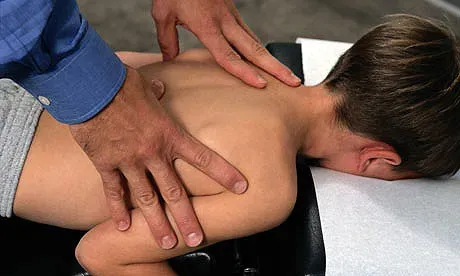Child Patient Receiving Osteopathic Treatment or Medical Massage | Mermaid Beach, Qld | Dive Chiropractic Centre