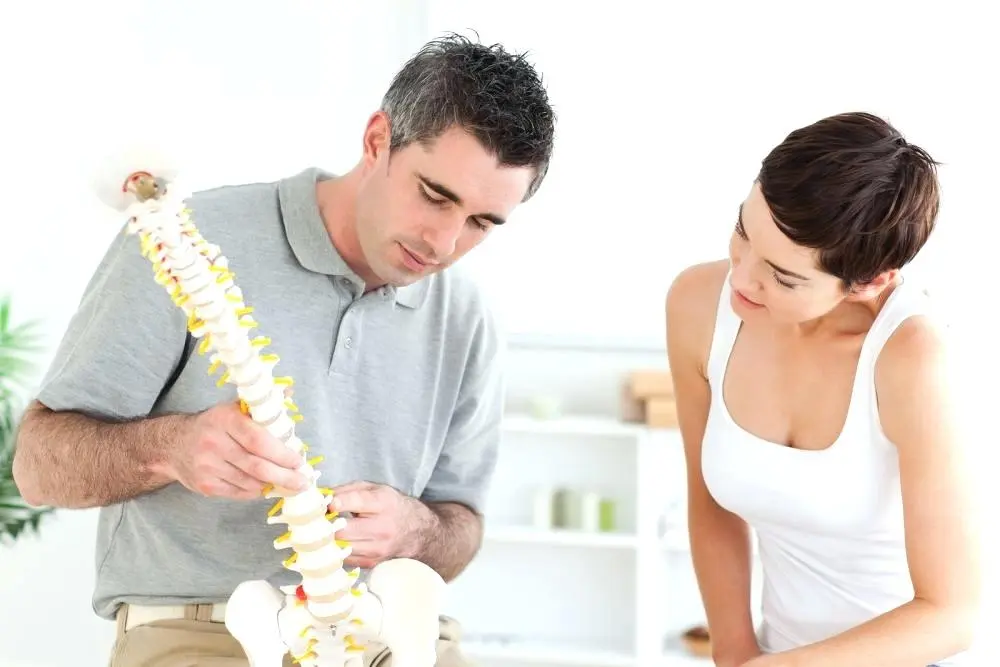 Doctor with Spine Model | Mermaid Beach, Qld | Dive Chiropractic Centre