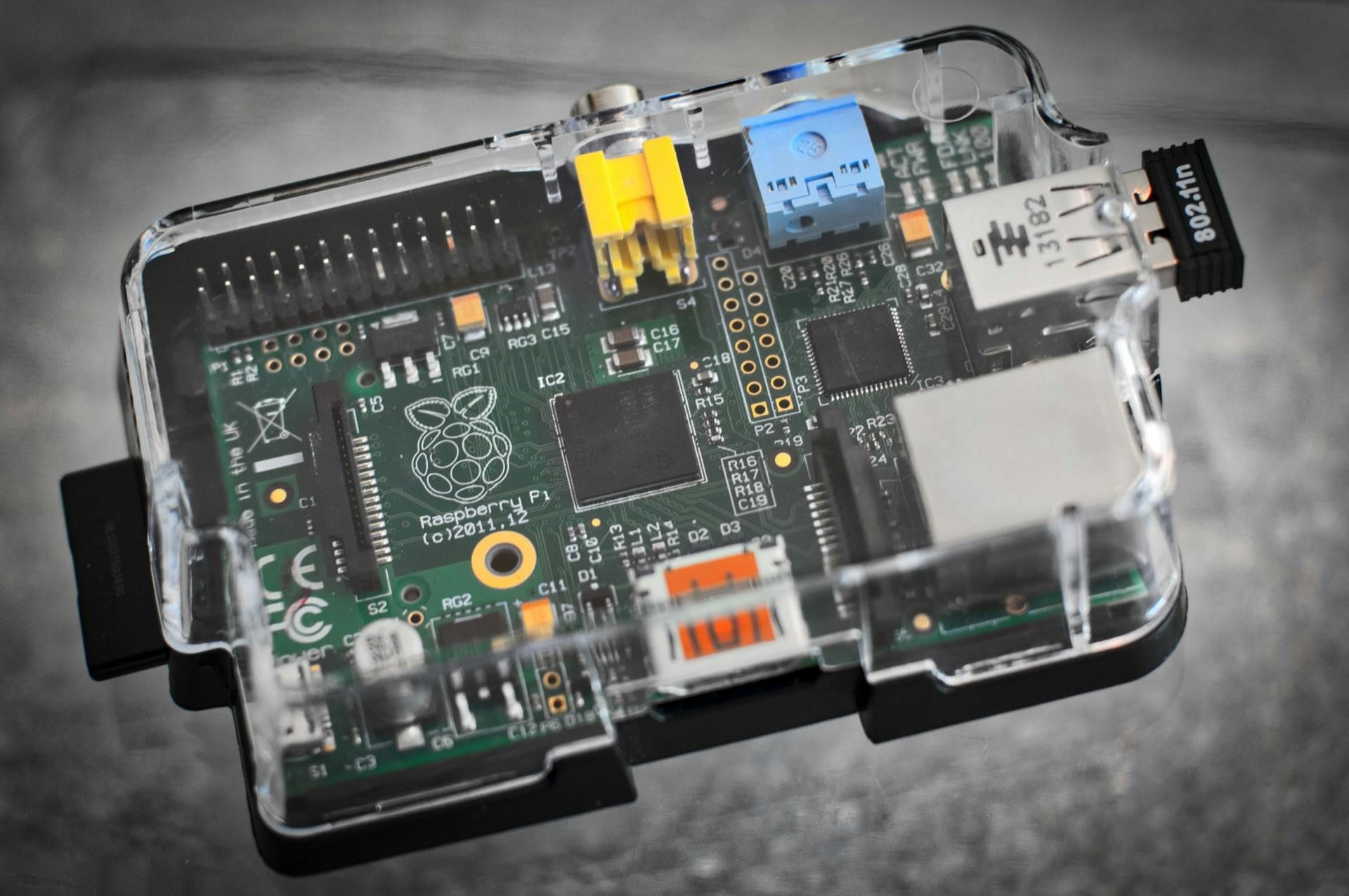 A close up of a raspberry pi computer in a clear case