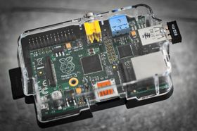 A close up of a raspberry pi computer in a clear case